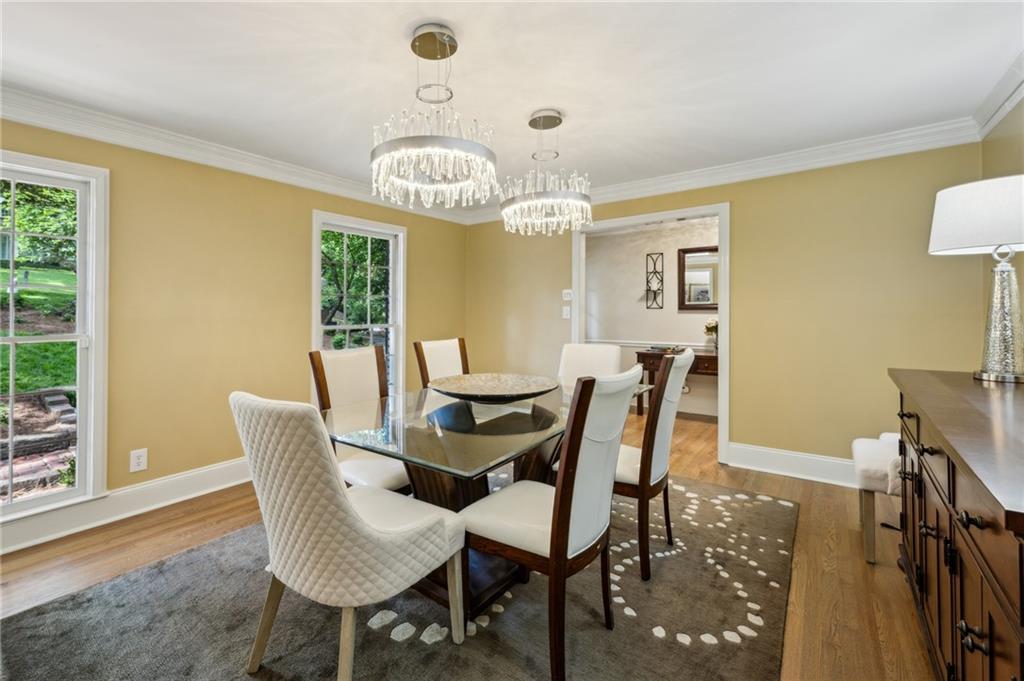 1130 Angelo Court Northeast Atlanta, GA 30319 - Photo 13 of 38 a view of a dining room with furniture window and wooden floor
