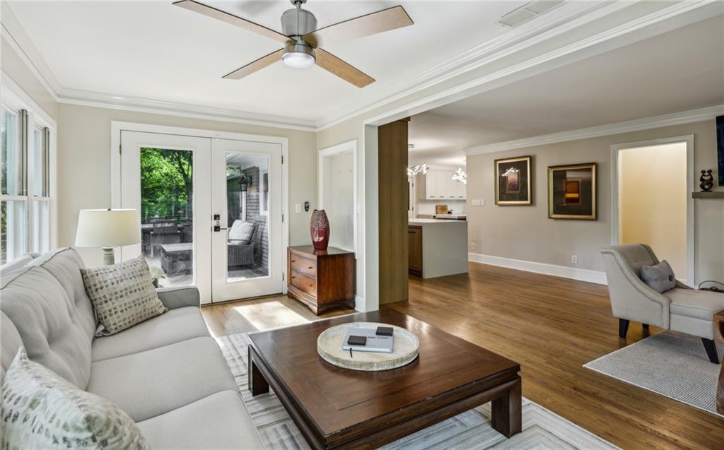 1130 Angelo Court Northeast Atlanta, GA 30319 - Photo 17 of 38 a living room with furniture and a wooden floor