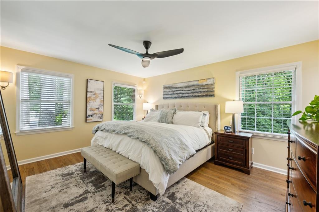 1130 Angelo Court Northeast Atlanta, GA 30319 - Photo 20 of 38 a spacious bedroom with a bed and a large window