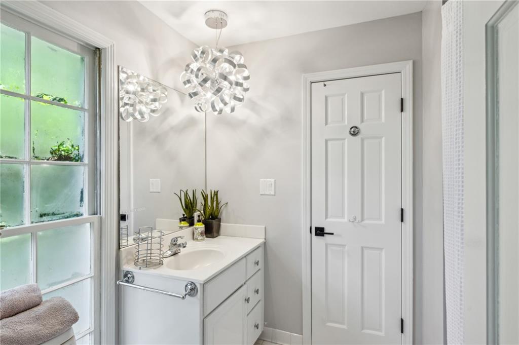 1130 Angelo Court Northeast Atlanta, GA 30319 - Photo 23 of 38 a bathroom with a sink toilet and shower