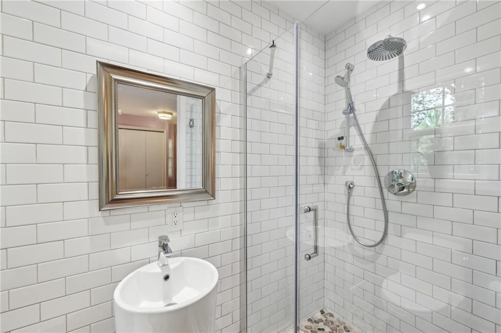 1130 Angelo Court Northeast Atlanta, GA 30319 - Photo 26 of 38 a bathroom with a sink a toilet and shower