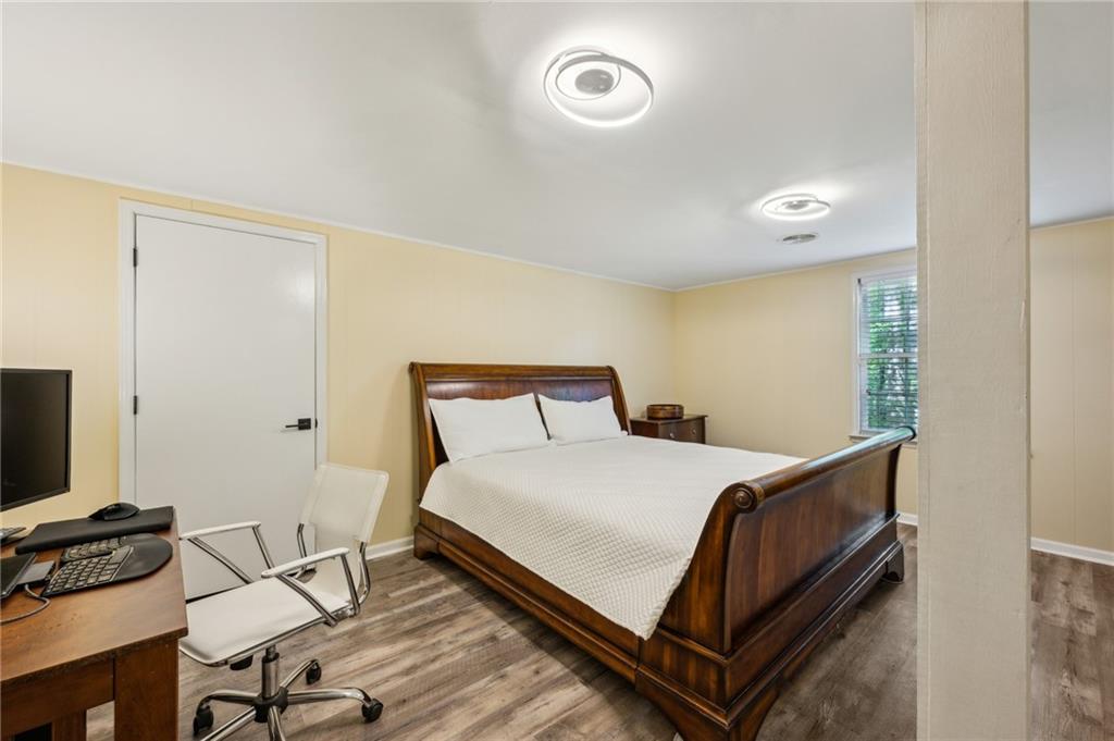 1130 Angelo Court Northeast Atlanta, GA 30319 - Photo 27 of 38 a bedroom with a bed and a flat screen tv