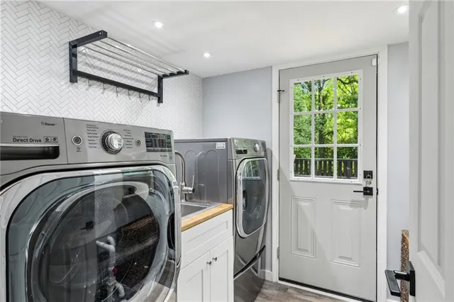 a utility room with dryer and washer