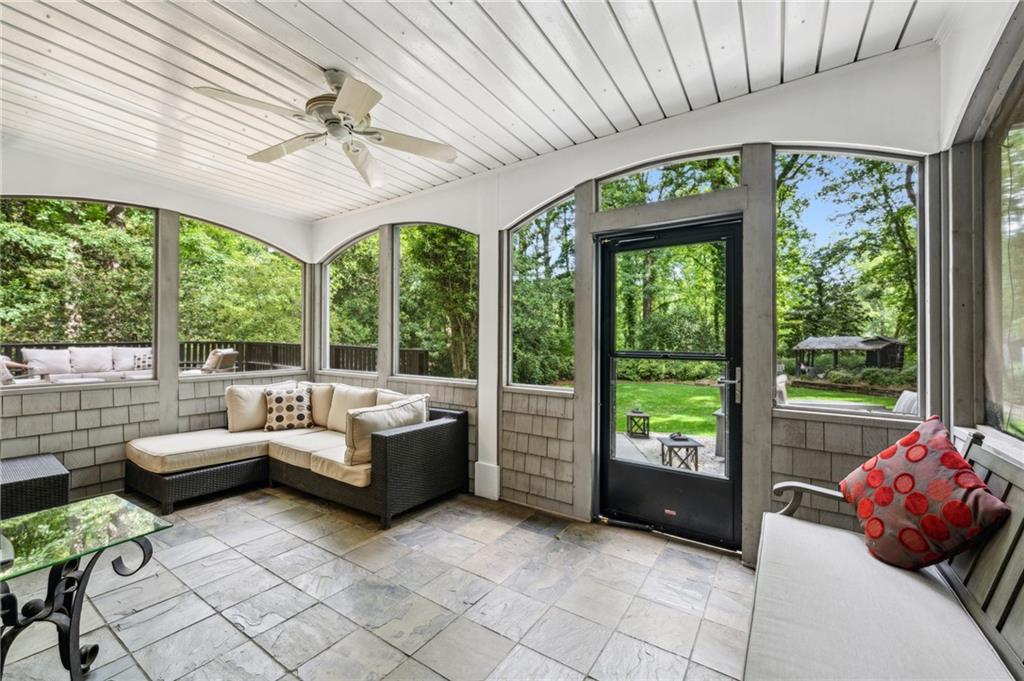 1130 Angelo Court Northeast Atlanta, GA 30319 - Photo 33 of 38 a living room with furniture and a large window
