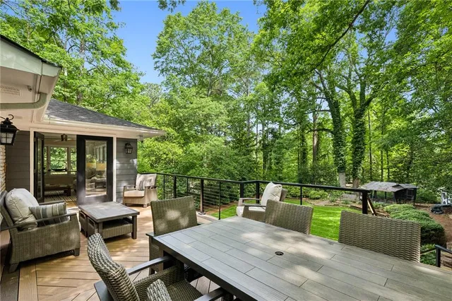 swimming pool view with a seating space