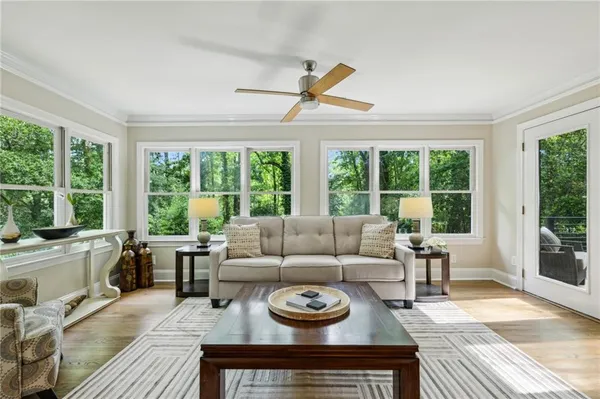 a living room with furniture and a open to dining table