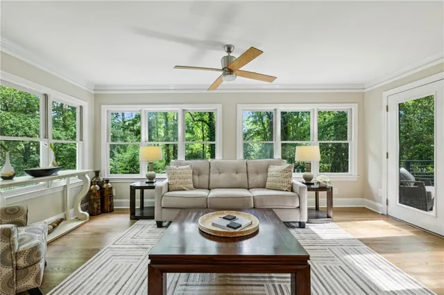 a living room with furniture and a open to dining table