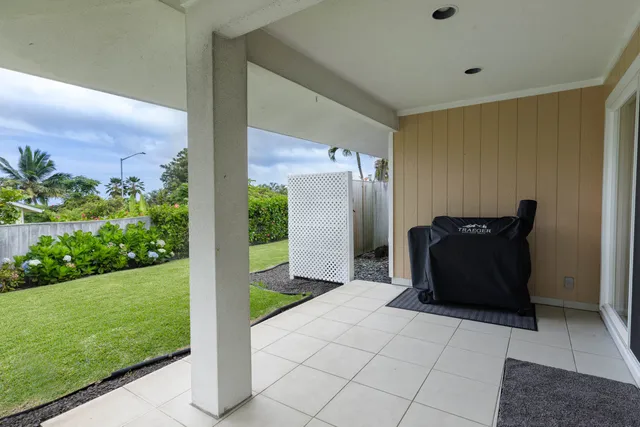 a view of a back yard from a hallway