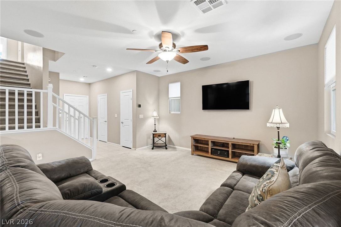 150 Fulgora Street Henderson, NV 89074 - Photo 34 of 92 Living room with carpet flooring, ceiling fan, and healthy amount of natural light