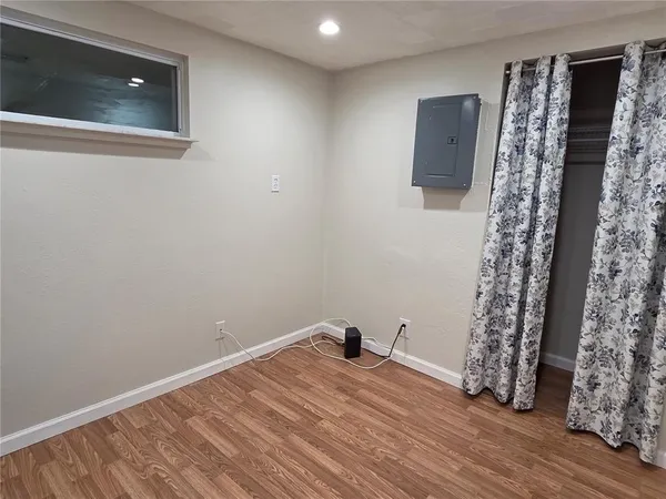 a room with a bed and a flat screen tv