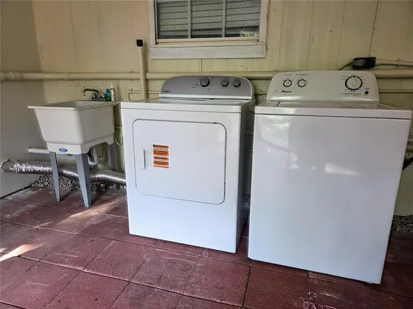 a utility room with dryer and washer