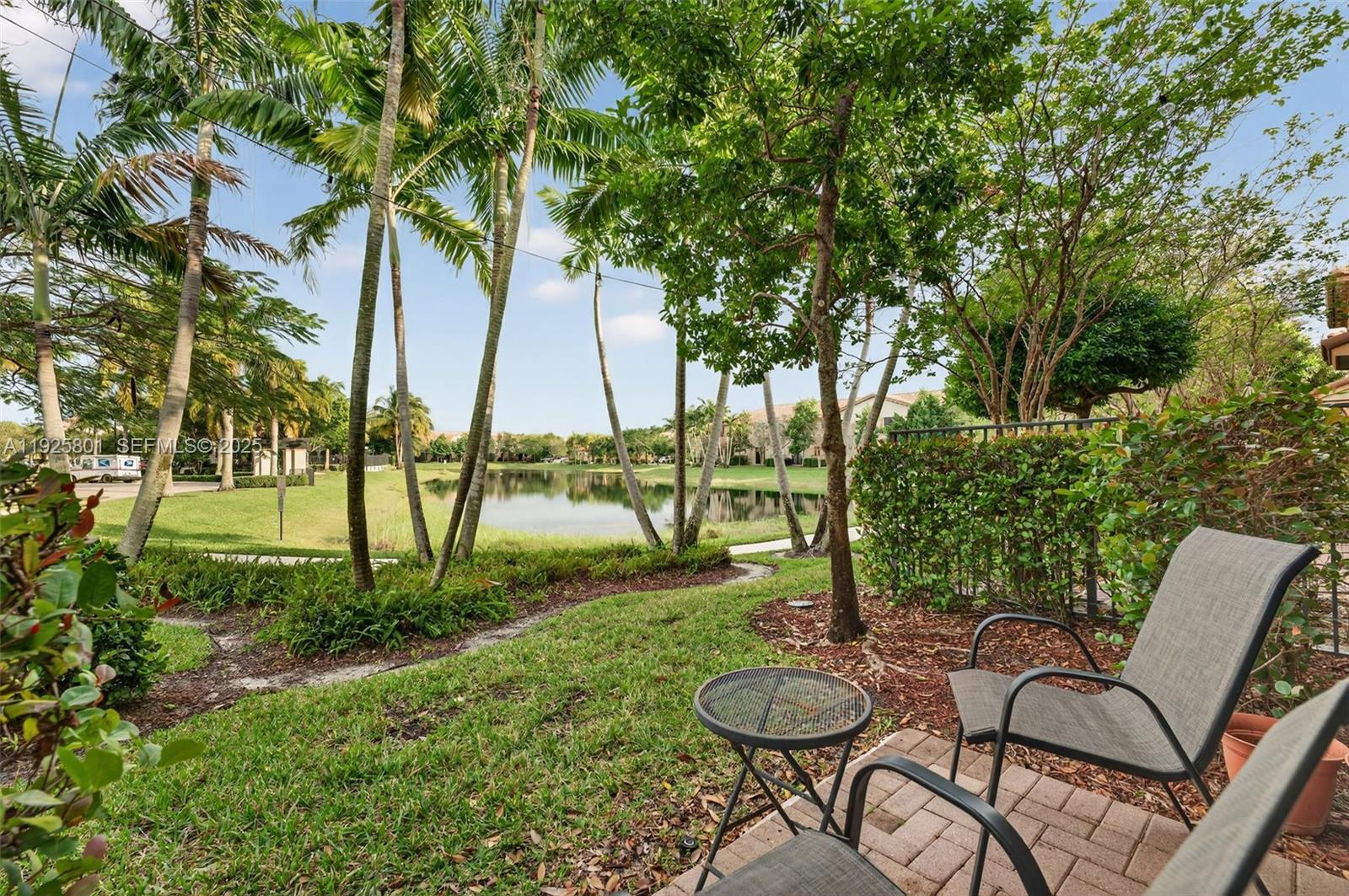 6978 Broadland Way Pompano Beach, FL 33073 - Photo 37 of 56 a view of a table and chairs in the garden