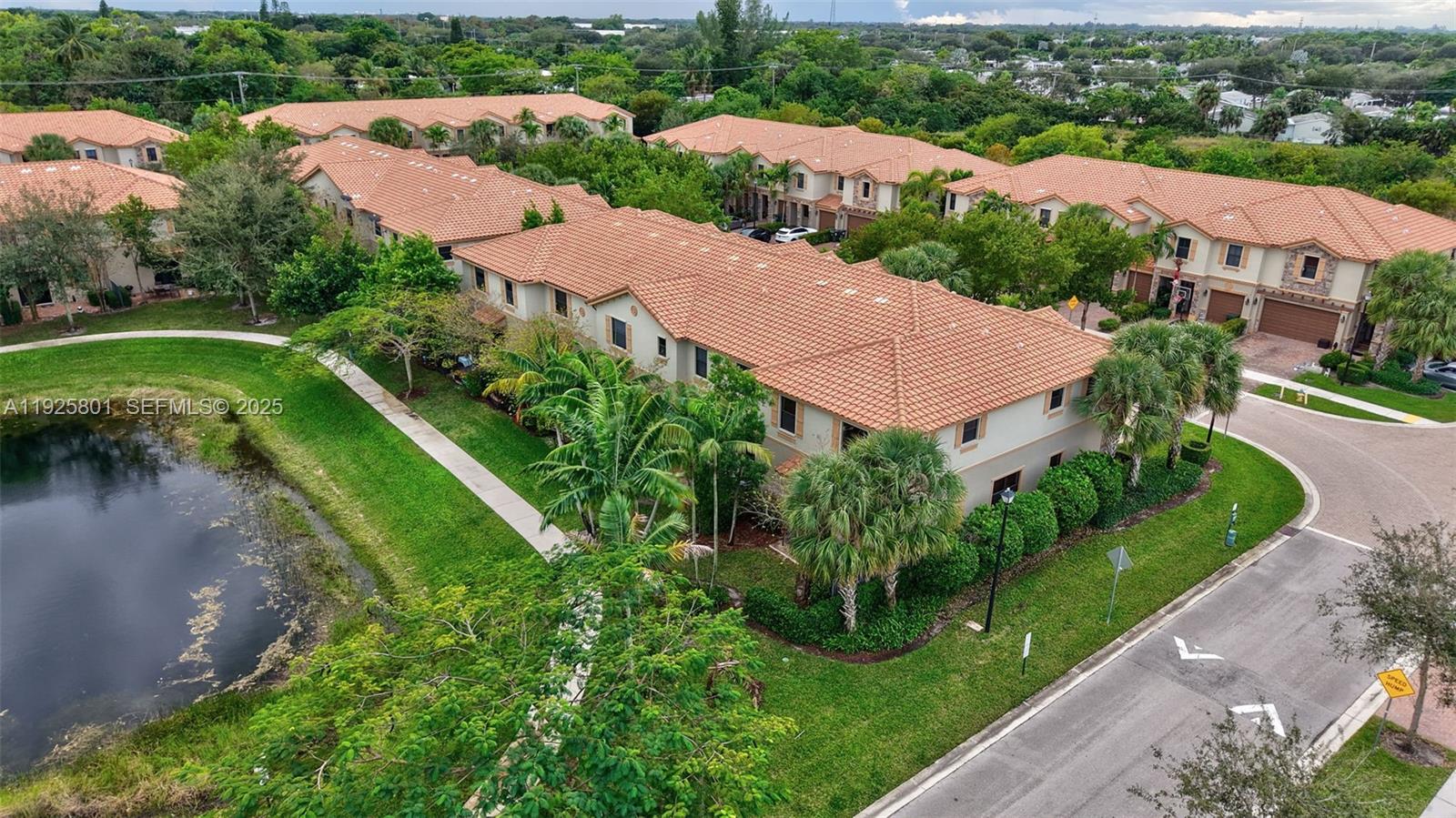 6978 Broadland Way Pompano Beach, FL 33073 - Photo 47 of 56 an aerial view of a house with a garden and lake view
