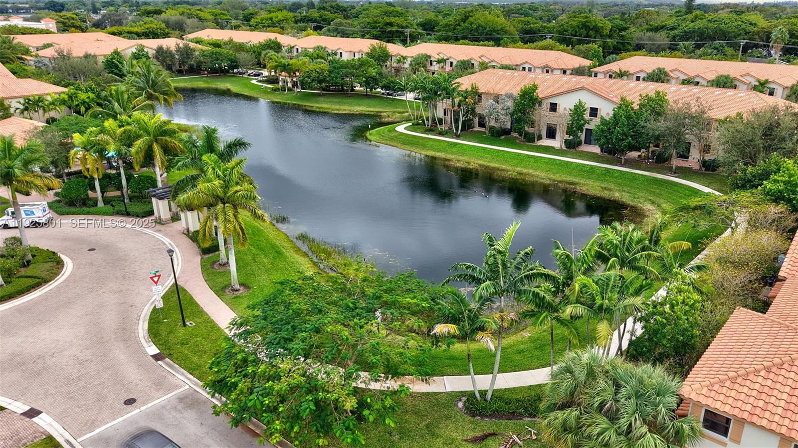 6978 Broadland Way Pompano Beach, FL 33073 - Photo 50 of 56 an aerial view of a house with a garden and lake view