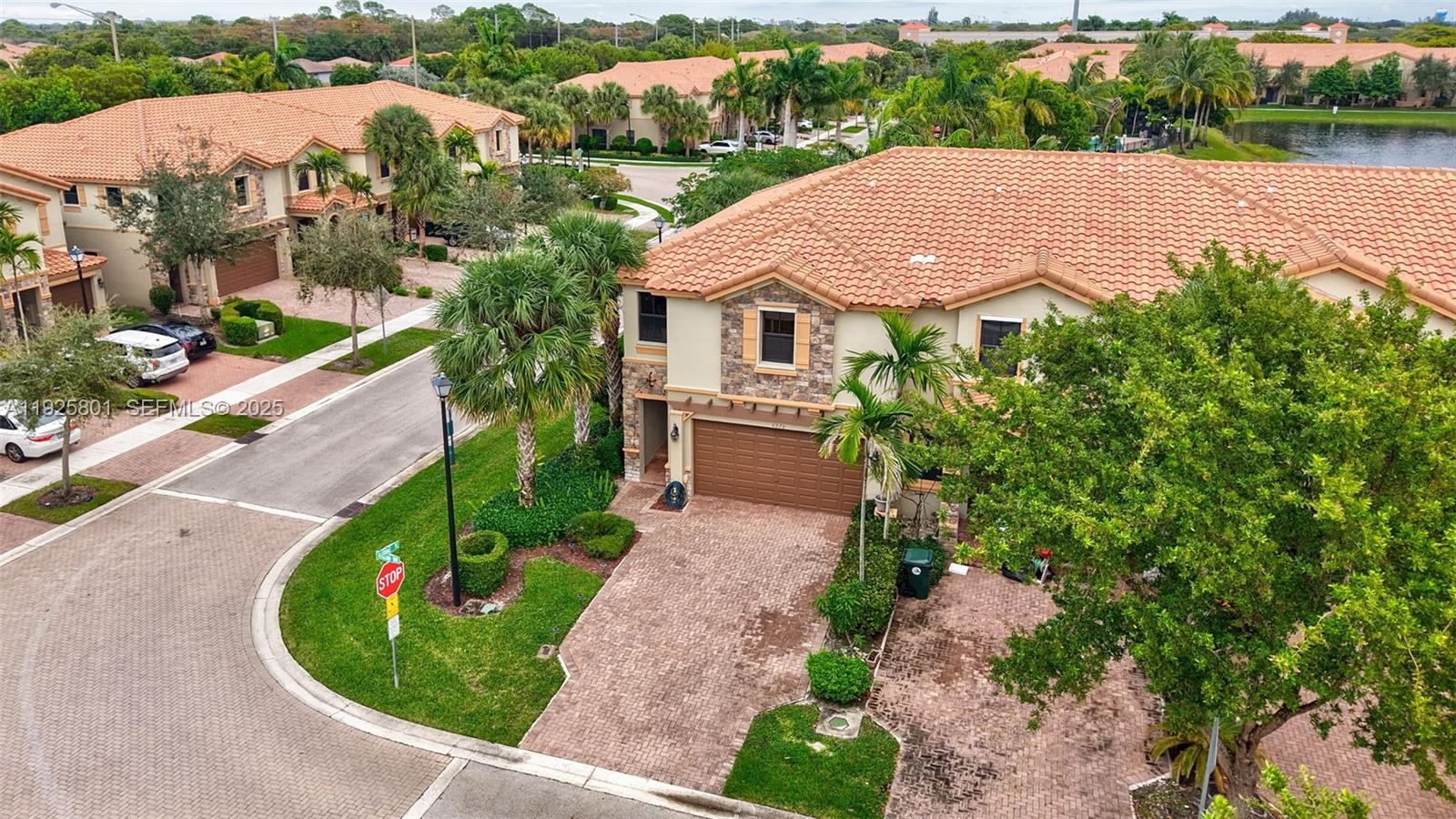 6978 Broadland Way Pompano Beach, FL 33073 - Photo 53 of 56 a aerial view of a house with garden