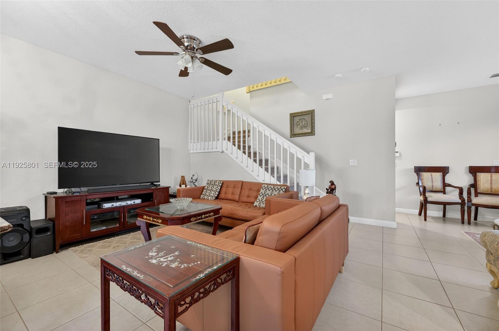 6978 Broadland Way Pompano Beach, FL 33073 - Photo 9 of 56 a living room with furniture and a flat screen tv