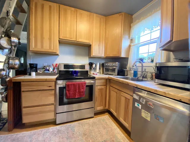 a bedroom with furniture and a chandelier
