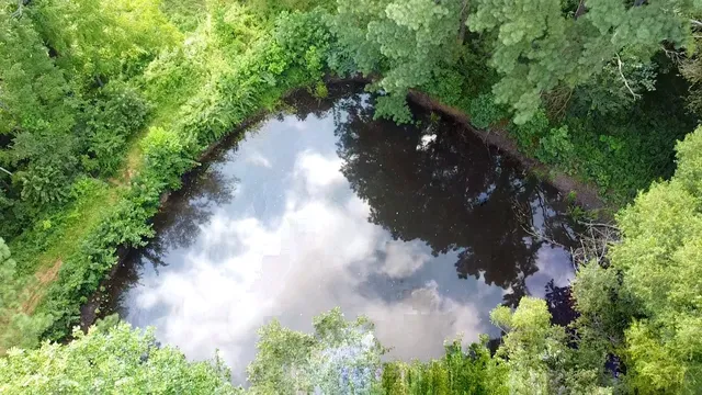 an aerial view of a house with yard