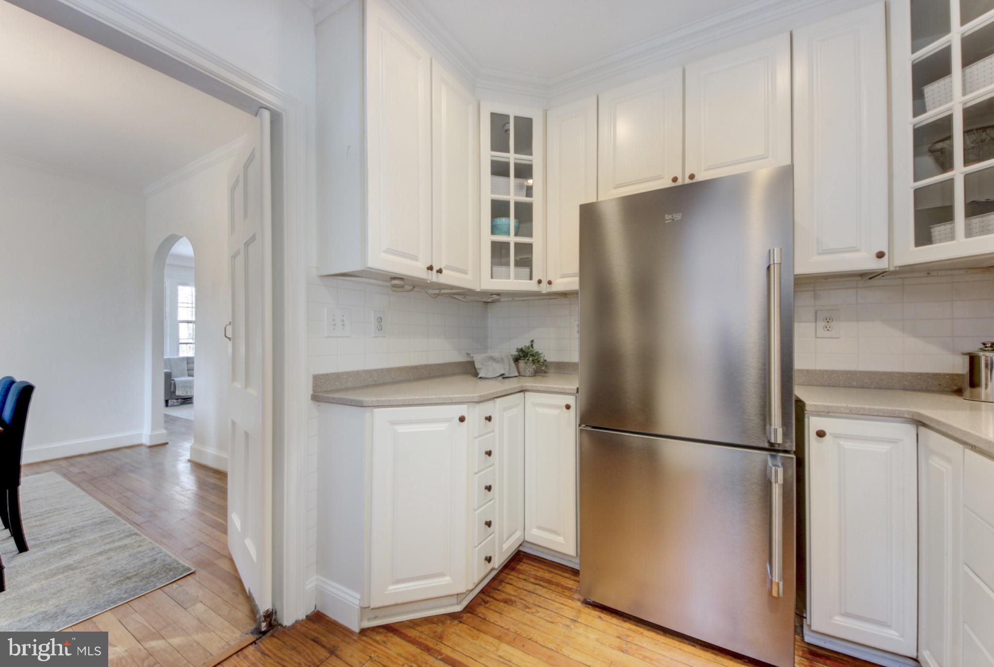 3020 Tilden Street Northwest, Unit 104 Washington, DC 20008 - Photo 12 of 40 Modern kitchen with sleek stainless steel fridge.