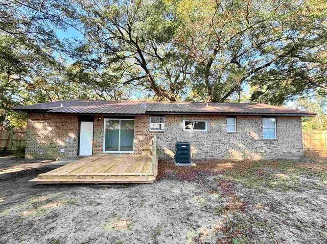 a view of a house with a sink and yard