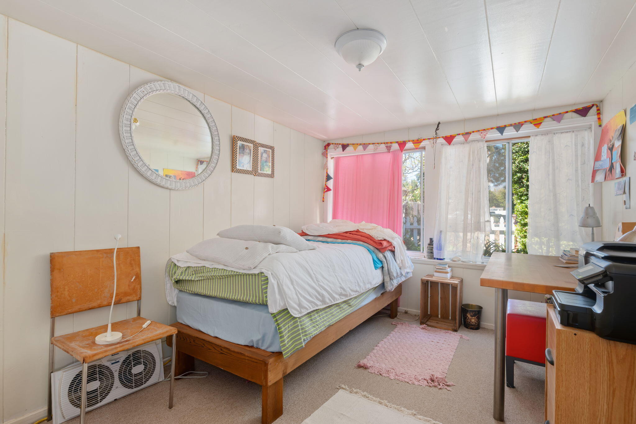 1090 Vallecito Road Carpinteria, CA 93013 - Photo 14 of 24 a bed room with a bed and a chair