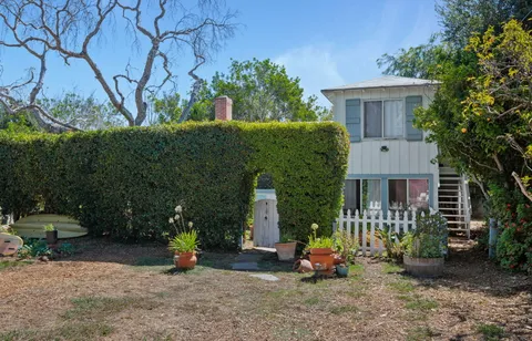 a backyard of a house with seating space