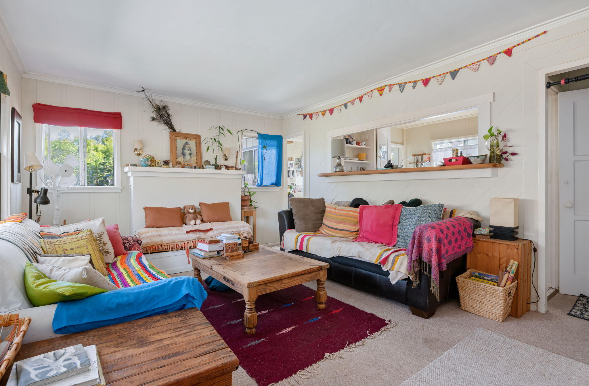 1090 Vallecito Road Carpinteria, CA 93013 - Photo 10 of 24 a living room with furniture and a book shelf