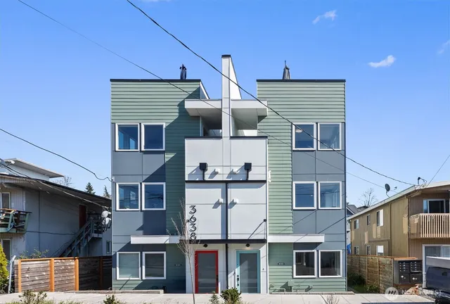 a front view of a house with garage