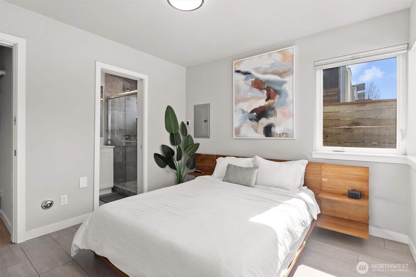 3638 36th Avenue South, Unit D Seattle, WA 98144 - Photo 21 of 21 a bedroom with a large bed and a window