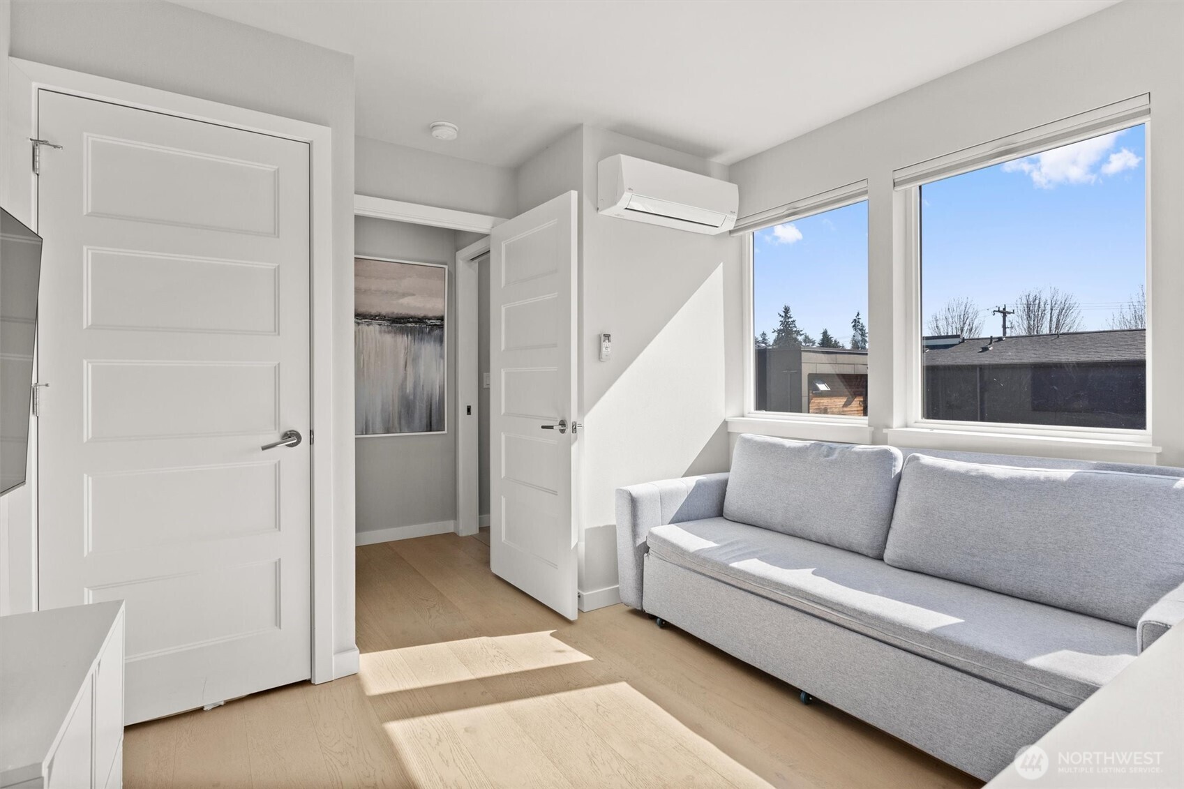 3638 36th Avenue South, Unit D Seattle, WA 98144 - Photo 7 of 21 a living room with furniture and a glass door