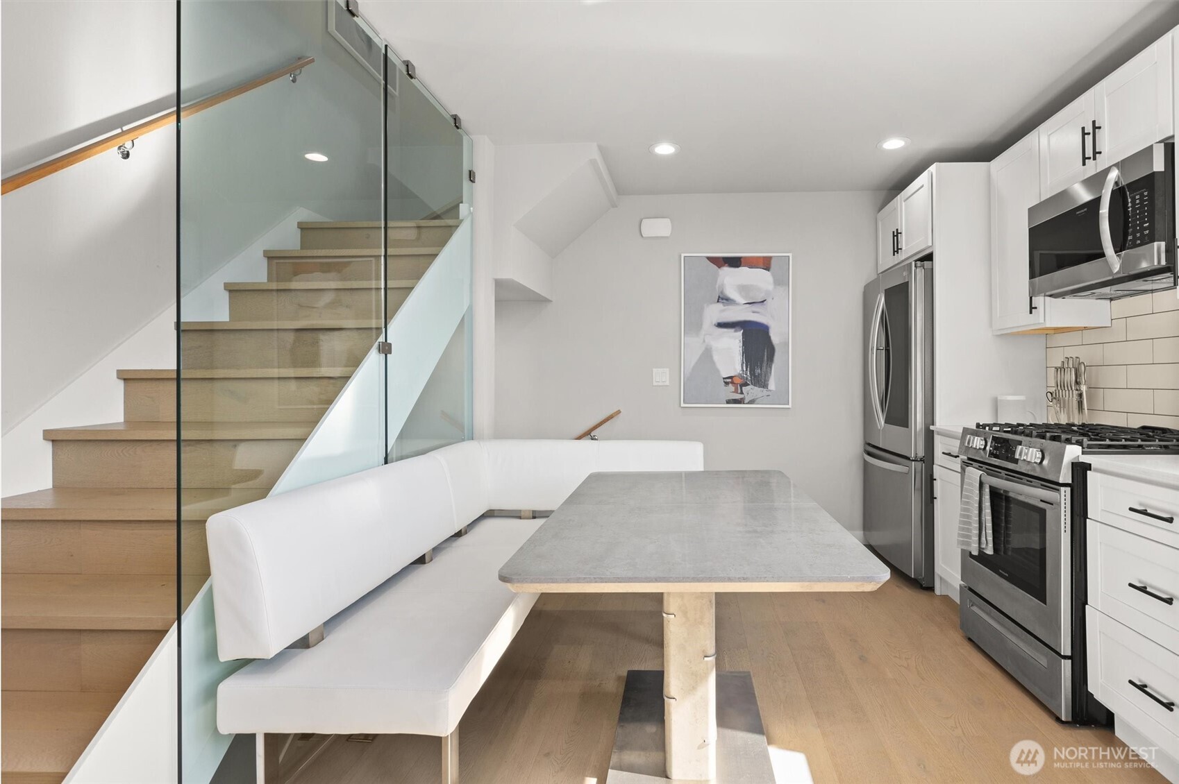 3638 36th Avenue South, Unit D Seattle, WA 98144 - Photo 10 of 21 a view of kitchen with stainless steel appliances kitchen island wooden floor and living room
