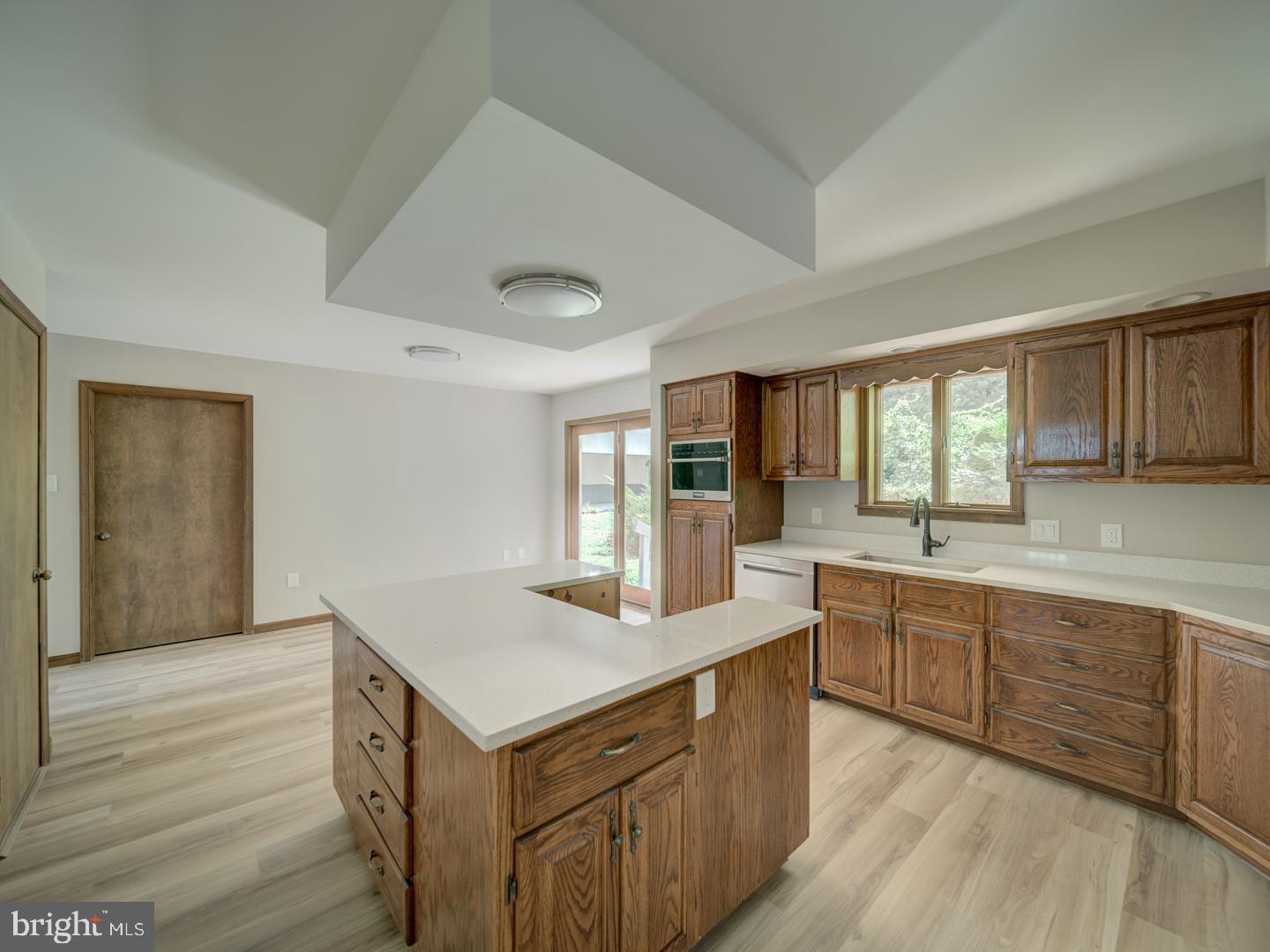 2750 Ridge Road Westminster, MD 21157 - Photo 24 of 57 a kitchen with sink cabinets and wooden floor