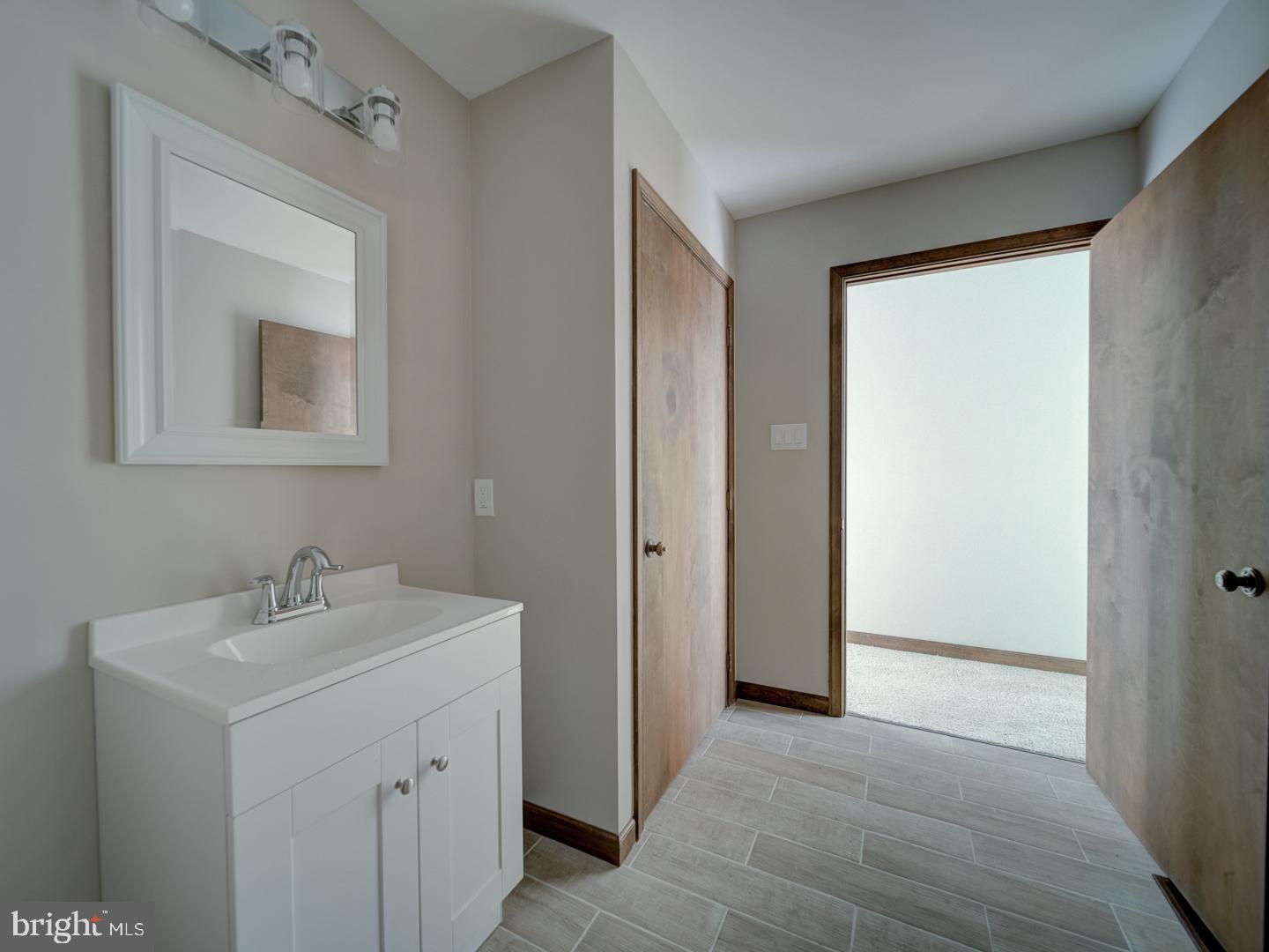 2750 Ridge Road Westminster, MD 21157 - Photo 36 of 57 a bathroom with a sink and a mirror