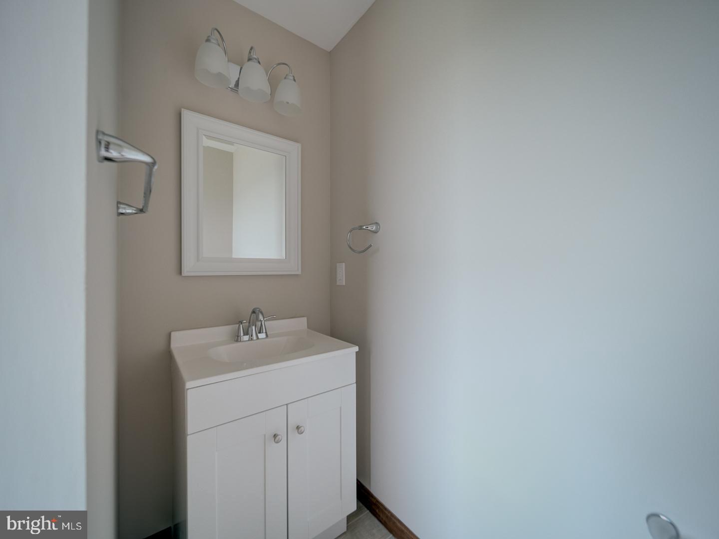 2750 Ridge Road Westminster, MD 21157 - Photo 50 of 57 a bathroom with a sink a vanity and a mirror