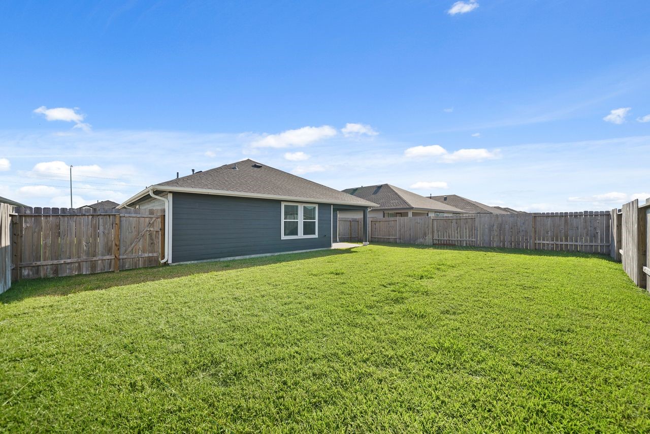 7502 Fierce Friesian Lane Rosharon, TX 77583 - Photo 21 of 21 a house view with a backyard space