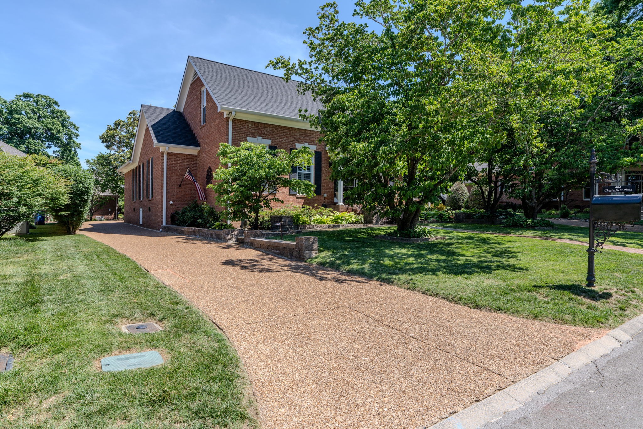 404 Chesterfield Place Franklin, TN 37064 - Photo 32 of 38 front view of house with a yard and potted plants