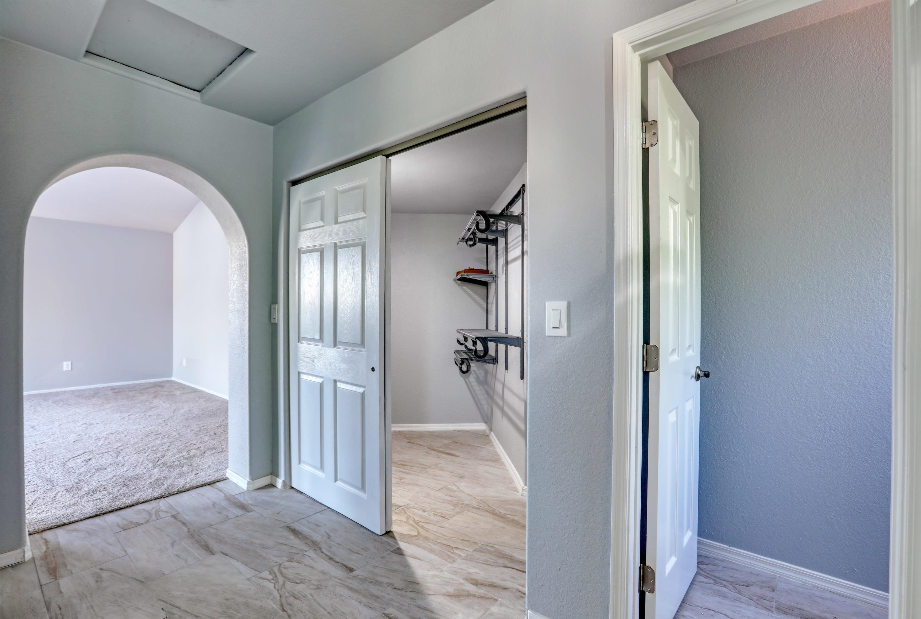 12560 North Wayfarer Way Oro Valley, AZ 85755 - Photo 30 of 43 a view of a hallway with wooden floor and a livingroom view