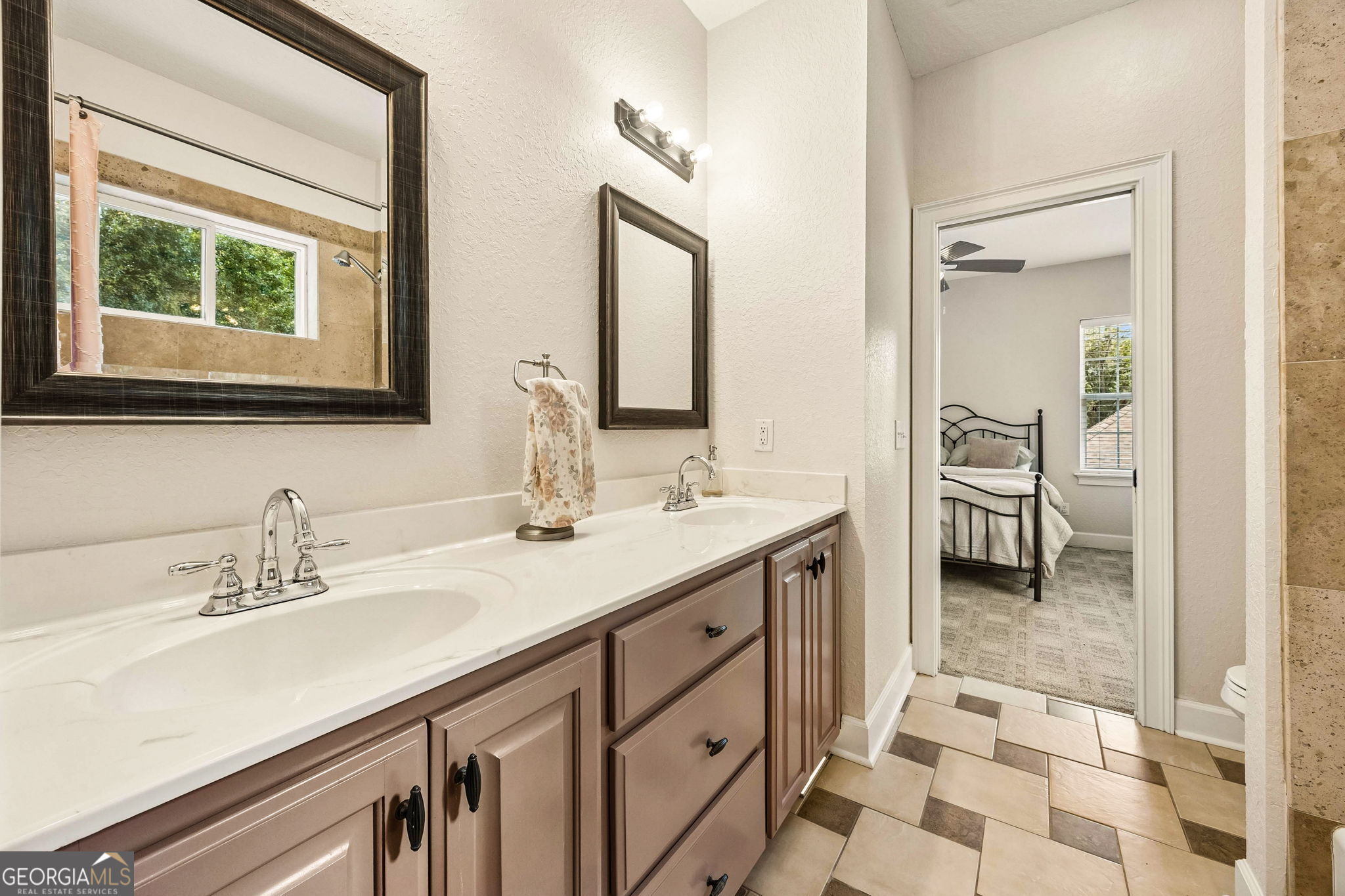 706 Hopewell Point Road White Oak, GA 31568 - Photo 42 of 84 Shared upstairs bathroom featuring a dual-sink vanity with ample counter space and storage.