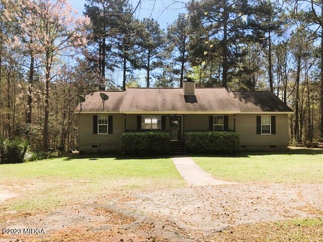745 Taylor Road Juliette, GA 31046 - Photo 1 of 16 a front view of a house with a yard