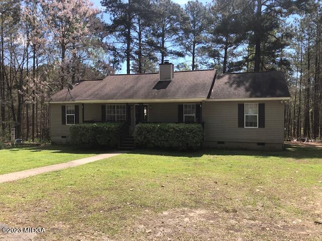 745 Taylor Road Juliette, GA 31046 - Photo 15 of 16 a front view of a house with yard and trees