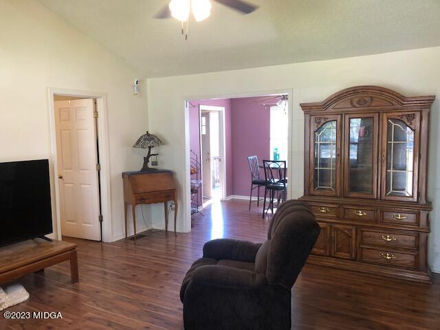 745 Taylor Road Juliette, GA 31046 - Photo 2 of 16 a living room with furniture and a flat screen tv