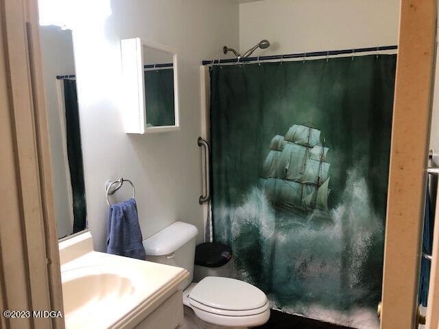 745 Taylor Road Juliette, GA 31046 - Photo 8 of 16 a bathroom with a toilet and a shower