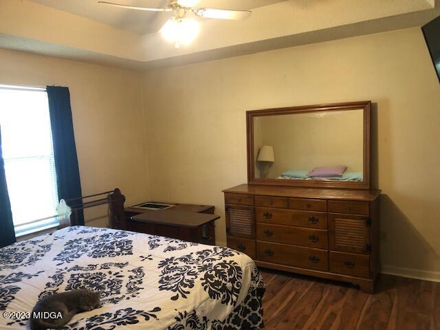 745 Taylor Road Juliette, GA 31046 - Photo 10 of 16 a bedroom with a bed and a dresser
