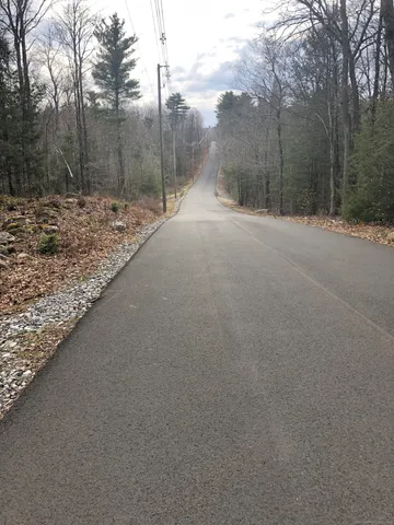 a backyard of a house with trees