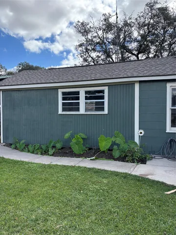 a backyard of a house with lots of green space