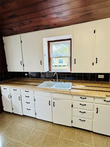 a view of cabinets with granite countertop cabinets