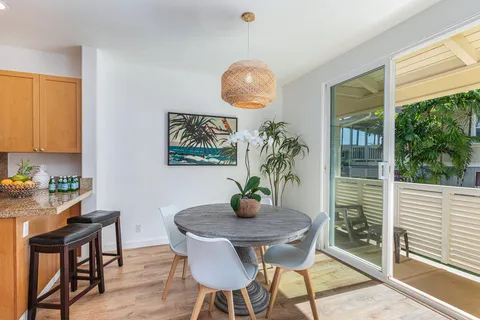 a view of a dining room with furniture window and outside view