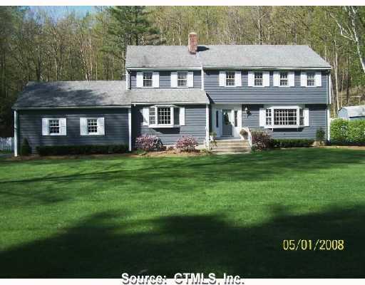 3 Rockspray Lane Simsbury, CT 06092 - Photo 1 of 1 a front view of a house with a yard and trees