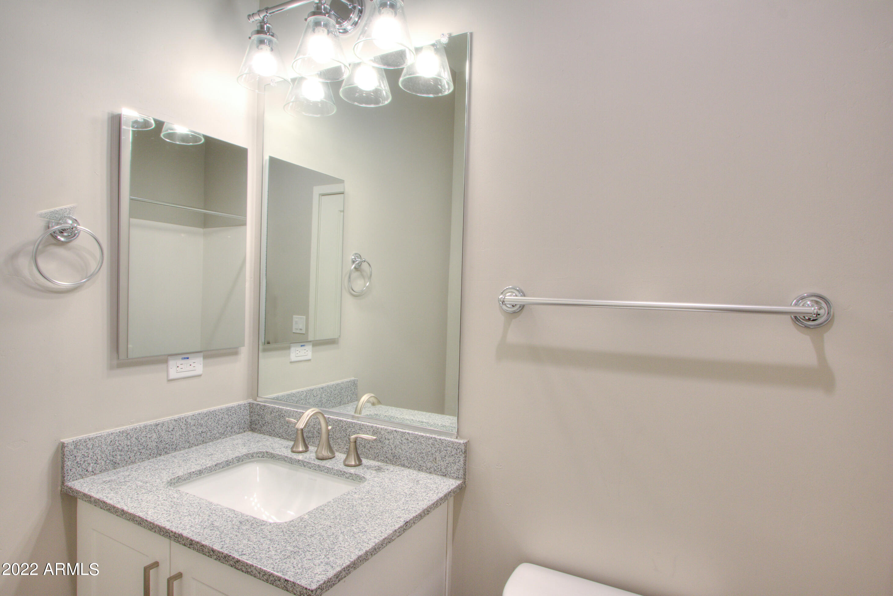 2245 North Dayton Street, Unit 3 Phoenix, AZ 85006 - Photo 15 of 26 a bathroom with a sink vanity and a mirror