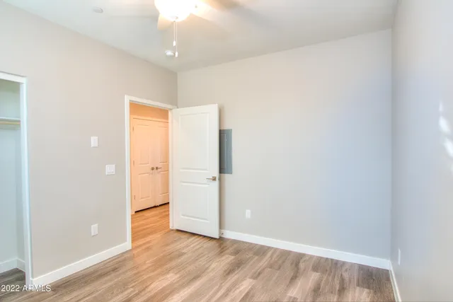 an empty room with wooden floor